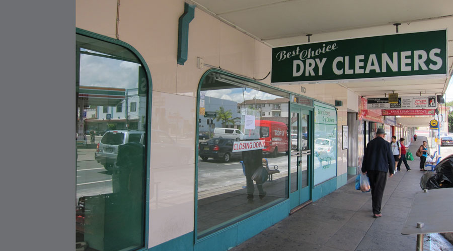 Before: the empty dry cleaners shopfront with a Closing Down sign, on the same Rockdale strip